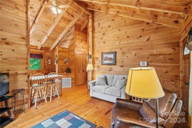 Welcome to your dream cabin nestled in the highly sought-after on Rumbling Bald Resort on Lake Lure in North Carolina - for sale on GolfHomes.com, golf home, golf lot