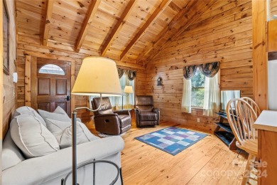 Welcome to your dream cabin nestled in the highly sought-after on Rumbling Bald Resort on Lake Lure in North Carolina - for sale on GolfHomes.com, golf home, golf lot