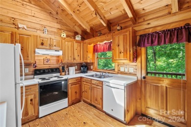 Welcome to your dream cabin nestled in the highly sought-after on Rumbling Bald Resort on Lake Lure in North Carolina - for sale on GolfHomes.com, golf home, golf lot