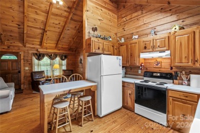 Welcome to your dream cabin nestled in the highly sought-after on Rumbling Bald Resort on Lake Lure in North Carolina - for sale on GolfHomes.com, golf home, golf lot