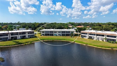 Rarely available 3-bedroom end unit featuring sweeping golf on Palm Aire Country Club of Sarasota in Florida - for sale on GolfHomes.com, golf home, golf lot