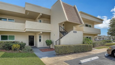 Rarely available 3-bedroom end unit featuring sweeping golf on Palm Aire Country Club of Sarasota in Florida - for sale on GolfHomes.com, golf home, golf lot