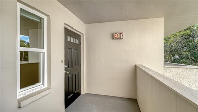 Rarely available 3-bedroom end unit featuring sweeping golf on Palm Aire Country Club of Sarasota in Florida - for sale on GolfHomes.com, golf home, golf lot