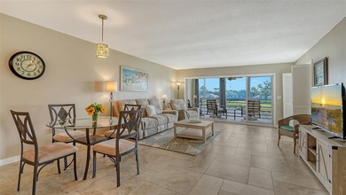 Rarely available 3-bedroom end unit featuring sweeping golf on Palm Aire Country Club of Sarasota in Florida - for sale on GolfHomes.com, golf home, golf lot