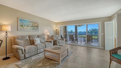 Rarely available 3-bedroom end unit featuring sweeping golf on Palm Aire Country Club of Sarasota in Florida - for sale on GolfHomes.com, golf home, golf lot