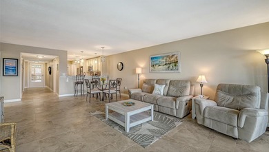 Rarely available 3-bedroom end unit featuring sweeping golf on Palm Aire Country Club of Sarasota in Florida - for sale on GolfHomes.com, golf home, golf lot