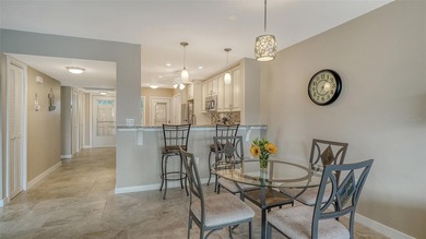 Rarely available 3-bedroom end unit featuring sweeping golf on Palm Aire Country Club of Sarasota in Florida - for sale on GolfHomes.com, golf home, golf lot