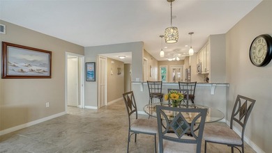 Rarely available 3-bedroom end unit featuring sweeping golf on Palm Aire Country Club of Sarasota in Florida - for sale on GolfHomes.com, golf home, golf lot