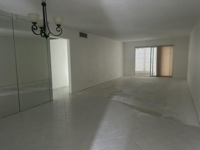 Fix & Flip Opportunity - Corner Unit in Martinique Court on Wynmoor Golf Course in Florida - for sale on GolfHomes.com, golf home, golf lot