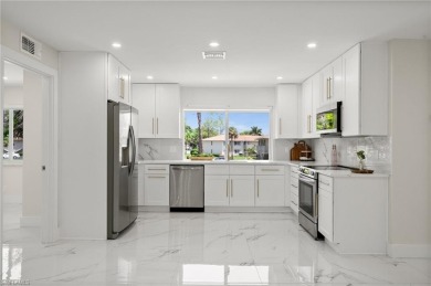 This beautifully renovated residence offers a seamless blend of on The Glades Golf and Country Club in Florida - for sale on GolfHomes.com, golf home, golf lot