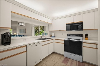 Turnkey 2-bedroom plus den, 2-bath second-floor, end unit condo on The Old Collier Golf Club in Florida - for sale on GolfHomes.com, golf home, golf lot