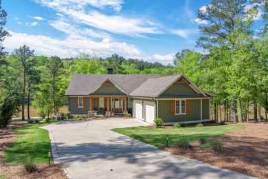 This charming home offers panoramic views of a serene pond in on Reynolds Lake Oconee - The Landing in Georgia - for sale on GolfHomes.com, golf home, golf lot