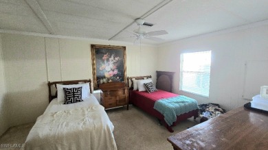 Charming Manufactured Home on Private Golf Course Lot in Riviera on Riviera Golf Club in Florida - for sale on GolfHomes.com, golf home, golf lot