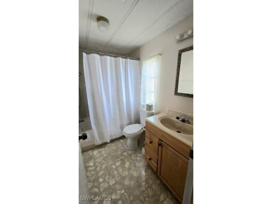 Charming Manufactured Home on Private Golf Course Lot in Riviera on Riviera Golf Club in Florida - for sale on GolfHomes.com, golf home, golf lot