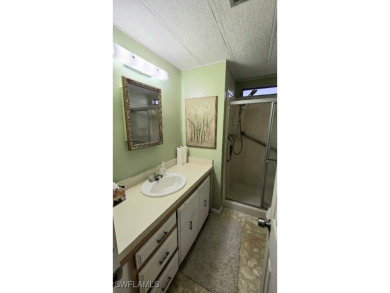 Charming Manufactured Home on Private Golf Course Lot in Riviera on Riviera Golf Club in Florida - for sale on GolfHomes.com, golf home, golf lot