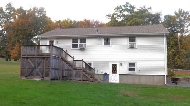 This split level home has fantastic curb appeal & is surrounded on Blackstone National Golf Course in Massachusetts - for sale on GolfHomes.com, golf home, golf lot