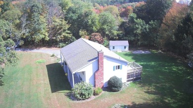 This split level home has fantastic curb appeal & is surrounded on Blackstone National Golf Course in Massachusetts - for sale on GolfHomes.com, golf home, golf lot