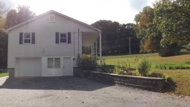 This split level home has fantastic curb appeal & is surrounded on Blackstone National Golf Course in Massachusetts - for sale on GolfHomes.com, golf home, golf lot