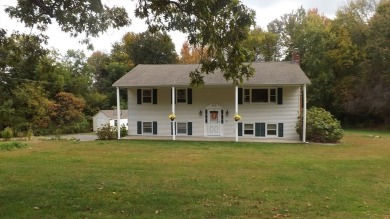 This split level home has fantastic curb appeal & is surrounded on Blackstone National Golf Course in Massachusetts - for sale on GolfHomes.com, golf home, golf lot