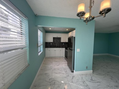 GORGEOUS updated 2 bed 2 bath unit on the 2nd floor in Kings on Kings Point Golf -Flanders Way in Florida - for sale on GolfHomes.com, golf home, golf lot