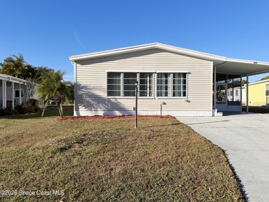 WOW! Move-in-ready and beautifully refreshed, this 2-bedroom on Barefoot Bay Golf Course in Florida - for sale on GolfHomes.com, golf home, golf lot