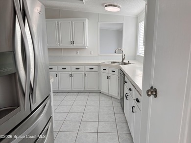 WOW! Move-in-ready and beautifully refreshed, this 2-bedroom on Barefoot Bay Golf Course in Florida - for sale on GolfHomes.com, golf home, golf lot