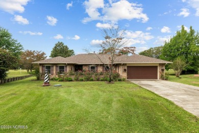 Welcome to this stunning 3-bedroom, 2.5-bathroom brick ranch on Harbour Point Golf Club in North Carolina - for sale on GolfHomes.com, golf home, golf lot