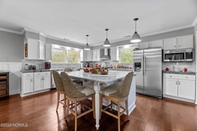 Welcome to this stunning 3-bedroom, 2.5-bathroom brick ranch on Harbour Point Golf Club in North Carolina - for sale on GolfHomes.com, golf home, golf lot