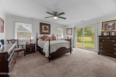Welcome to this stunning 3-bedroom, 2.5-bathroom brick ranch on Harbour Point Golf Club in North Carolina - for sale on GolfHomes.com, golf home, golf lot