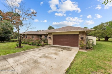 Welcome to this stunning 3-bedroom, 2.5-bathroom brick ranch on Harbour Point Golf Club in North Carolina - for sale on GolfHomes.com, golf home, golf lot