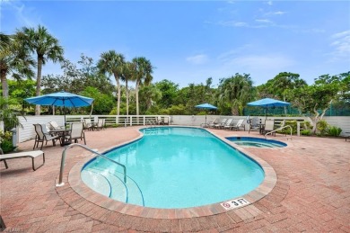 Tucked away in the coveted Oakwood Carriage Homes of Bonita Bay on Bonita Bay West in Florida - for sale on GolfHomes.com, golf home, golf lot