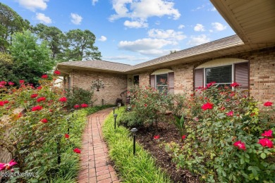Welcome to this stunning 3-bedroom, 2.5-bathroom brick ranch on Harbour Point Golf Club in North Carolina - for sale on GolfHomes.com, golf home, golf lot