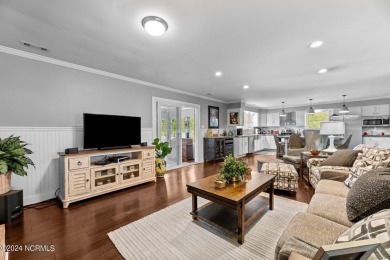 Welcome to this stunning 3-bedroom, 2.5-bathroom brick ranch on Harbour Point Golf Club in North Carolina - for sale on GolfHomes.com, golf home, golf lot