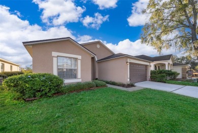 This beautifully maintained 4-bedroom, 2-bathroom pool home is on Ridgewood Lakes Golf and Country Club in Florida - for sale on GolfHomes.com, golf home, golf lot