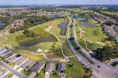 This beautifully maintained 4-bedroom, 2-bathroom pool home is on Ridgewood Lakes Golf and Country Club in Florida - for sale on GolfHomes.com, golf home, golf lot