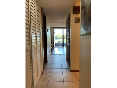 Ground floor condo with no stairs and breathtaking waterviews on Pasadena Yacht and Country Club in Florida - for sale on GolfHomes.com, golf home, golf lot