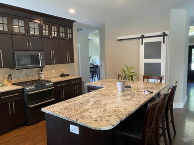 This home has it all! 5 Bedrooms, spacious master has a standing on Eagle Hills Golf Course in Idaho - for sale on GolfHomes.com, golf home, golf lot