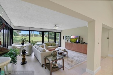 RESORT STYLE LIVING.  THIS RARELY AVAILABLE REMODELED VILLA WITH on Boca West Golf and Country Club in Florida - for sale on GolfHomes.com, golf home, golf lot