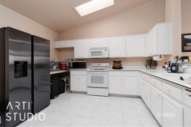 This charming two-bedroom, two-bath townhome in Sunset Greens on CasaBlanca Resort and Casino in Nevada - for sale on GolfHomes.com, golf home, golf lot