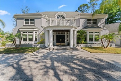 Stunning 4-Bedroom Pool Home with Office, Gazebo  Pond Views in on Tampa Palms Golf and Country Club in Florida - for sale on GolfHomes.com, golf home, golf lot