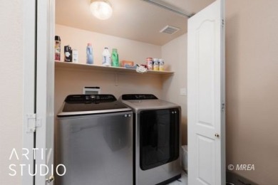 This charming two-bedroom, two-bath townhome in Sunset Greens on CasaBlanca Resort and Casino in Nevada - for sale on GolfHomes.com, golf home, golf lot