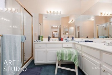 This charming two-bedroom, two-bath townhome in Sunset Greens on CasaBlanca Resort and Casino in Nevada - for sale on GolfHomes.com, golf home, golf lot