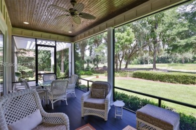 This custom home, set on an oversized homesite, offers 4 on Colleton River Plantation Club in South Carolina - for sale on GolfHomes.com, golf home, golf lot