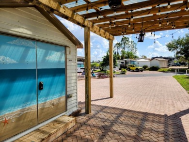 This primo lot in the luxury motorcoach section is once again on Deer Creek RV Golf Resort in Florida - for sale on GolfHomes.com, golf home, golf lot