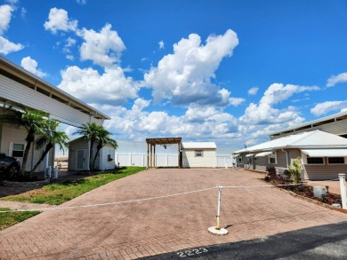 This primo lot in the luxury motorcoach section is once again on Deer Creek RV Golf Resort in Florida - for sale on GolfHomes.com, golf home, golf lot