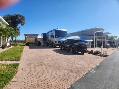 This primo lot in the luxury motorcoach section is once again on Deer Creek RV Golf Resort in Florida - for sale on GolfHomes.com, golf home, golf lot