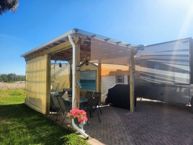 This primo lot in the luxury motorcoach section is once again on Deer Creek RV Golf Resort in Florida - for sale on GolfHomes.com, golf home, golf lot