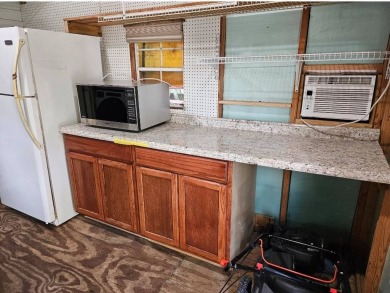 Very nice air-conditioned storage shed, with W/D, refrigerator & on The Great Outdoors Golf and Country Club in Florida - for sale on GolfHomes.com, golf home, golf lot