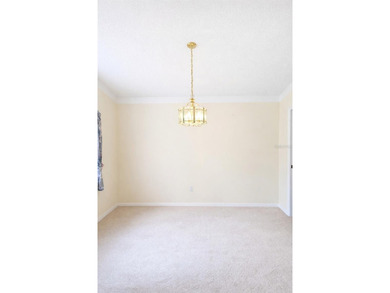 One or more photo(s) has been virtually staged. Welcome to easy on The Grand Club - Pine Lakes Course in Florida - for sale on GolfHomes.com, golf home, golf lot