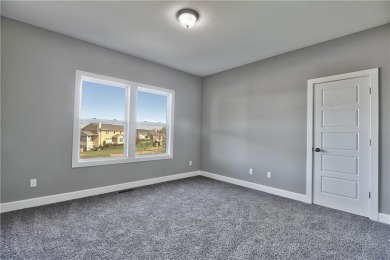Big and beautiful Niko plan by Prieb Homes is situated next to on Shawnee Golf and Country Club in Kansas - for sale on GolfHomes.com, golf home, golf lot